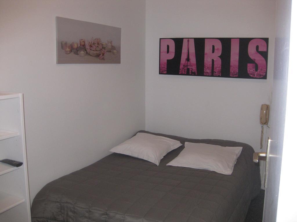 Le Monopole Hotel Reims Ruang foto