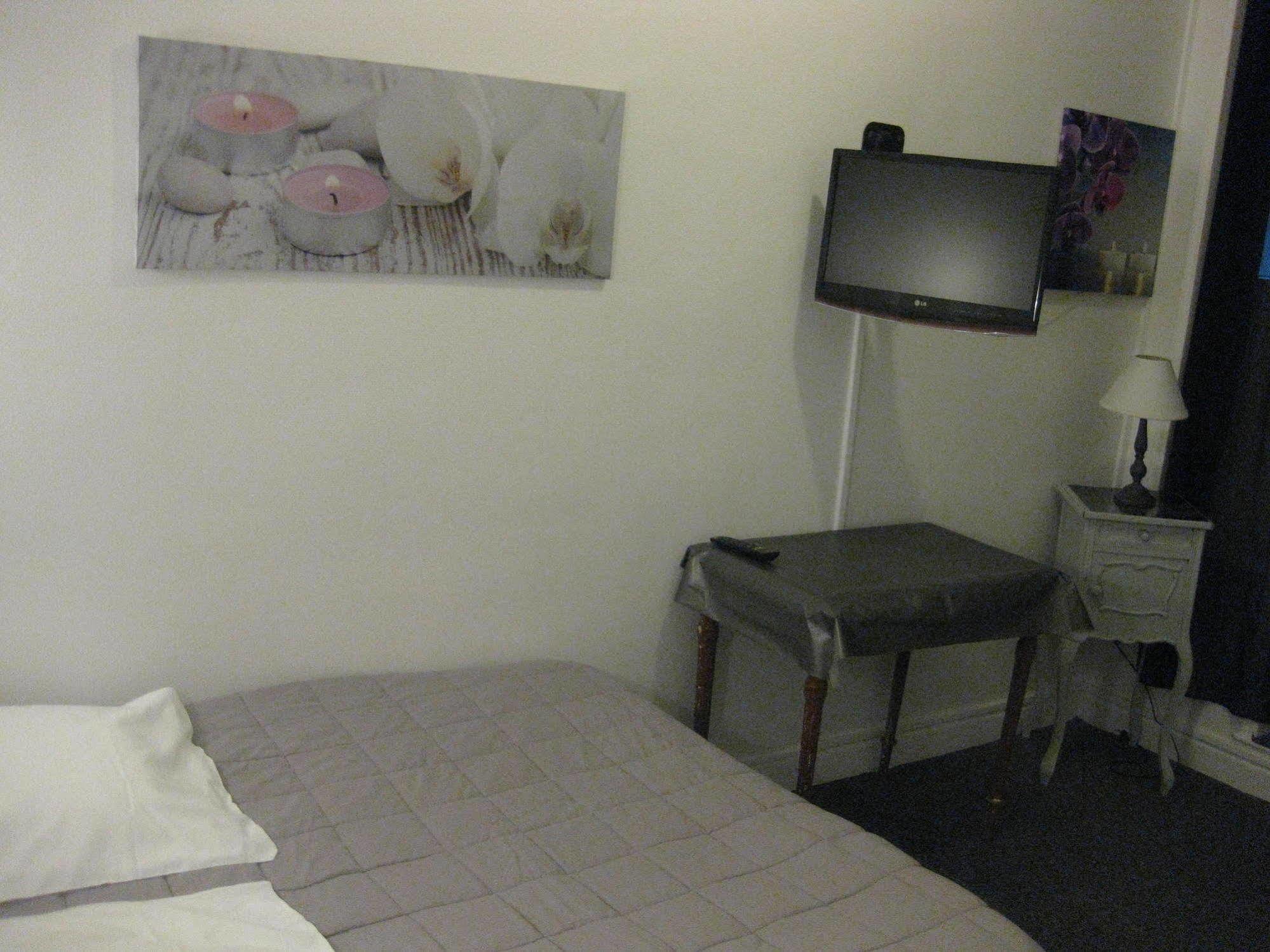 Le Monopole Hotel Reims Bagian luar foto